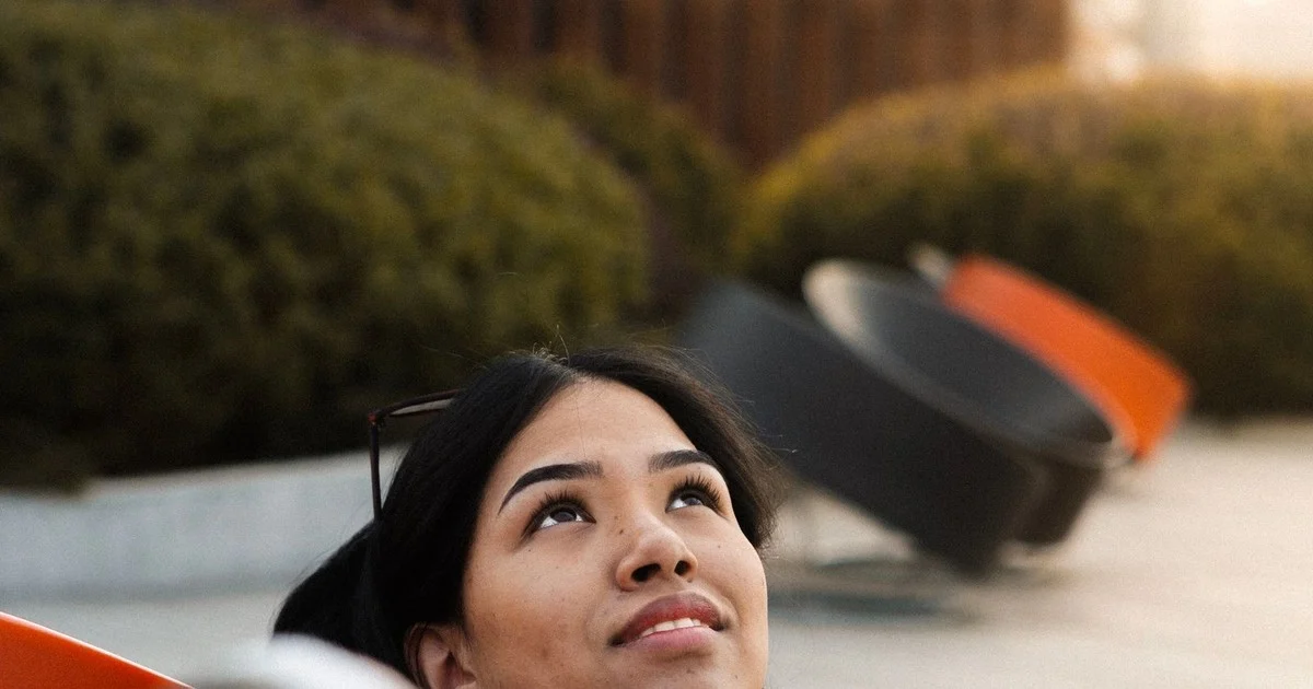 Woman looking up thoughtfully, wondering how long perimenopause will last