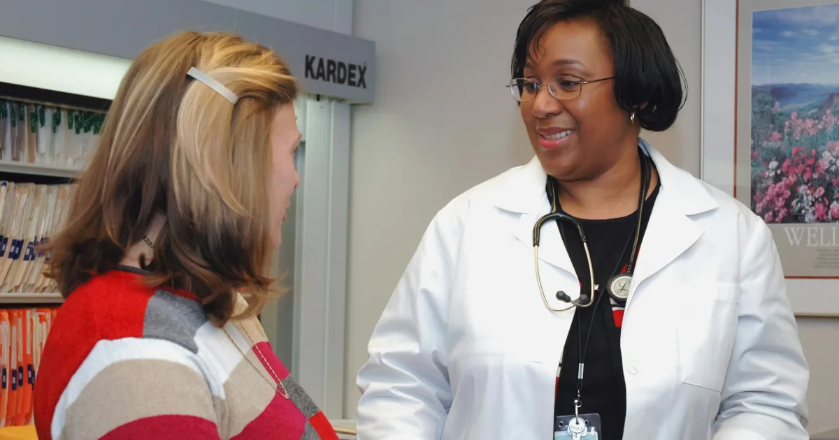 Woman talking with a female doctor in a clinic